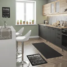 Green kitchen with a design touch